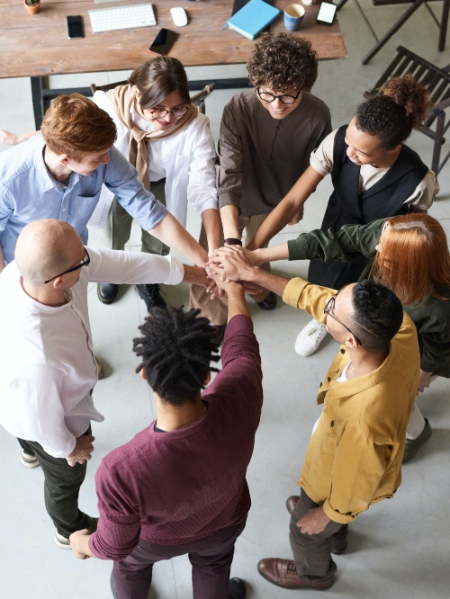 group putting hands in together